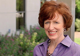 head shot of patient Teri Taylor in front of the Palmer Clinic