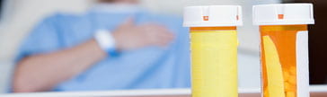 hospital patient with pill bottles