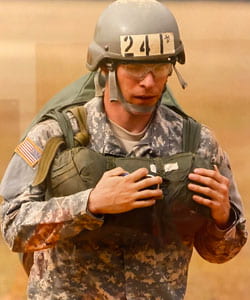 Derron McLaury in military uniform and helmet.