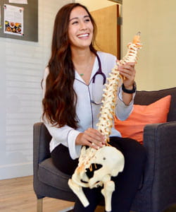 Felisha Truong, D.C. (West, ’20), posing with model spine.
