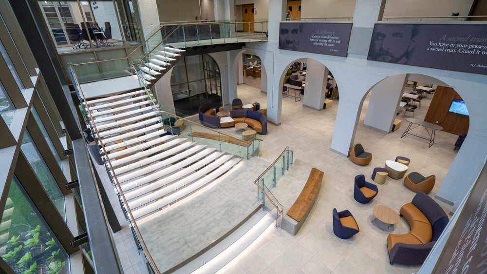 Large open room with staircase and chairs