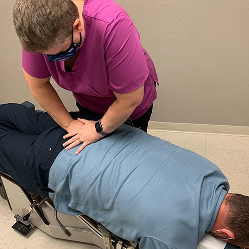 Chiropractor performing an adjustment