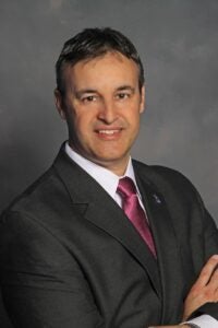 Photo of Dennis Marchiori, D.C., Ph.D., Chancellor and CEO of Palmer College