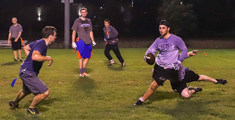 Students playing flag football.