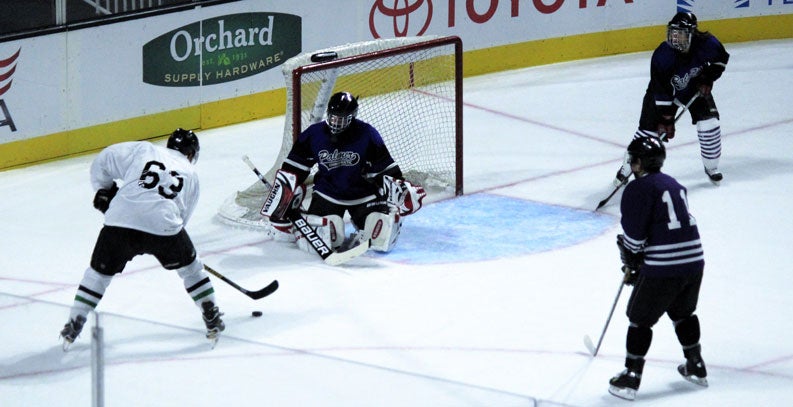 Hockey team goalie preparing.