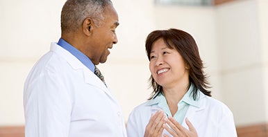 Two doctors talking to one another