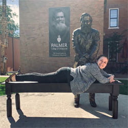 Kate McKenzie, Palmer Main student, with the First Adjustment Statue.
