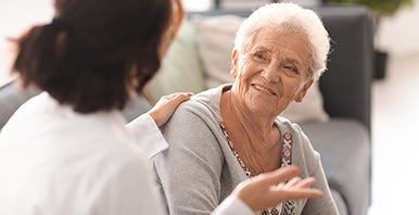 Two individuals talking to one another.