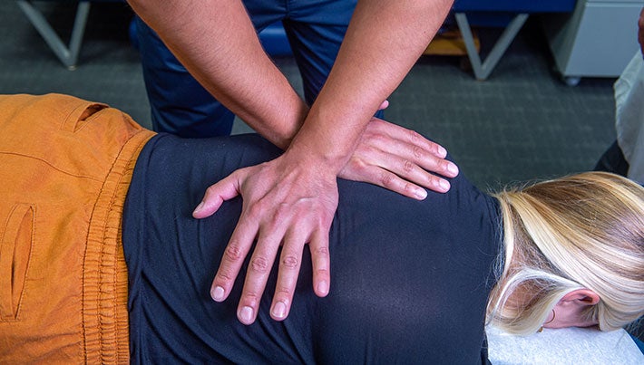 Chiropractor performing an adjustment