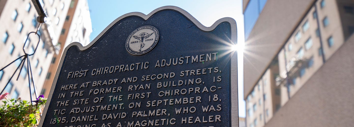 Historical marker commemorating the first chiropractic adjustment.