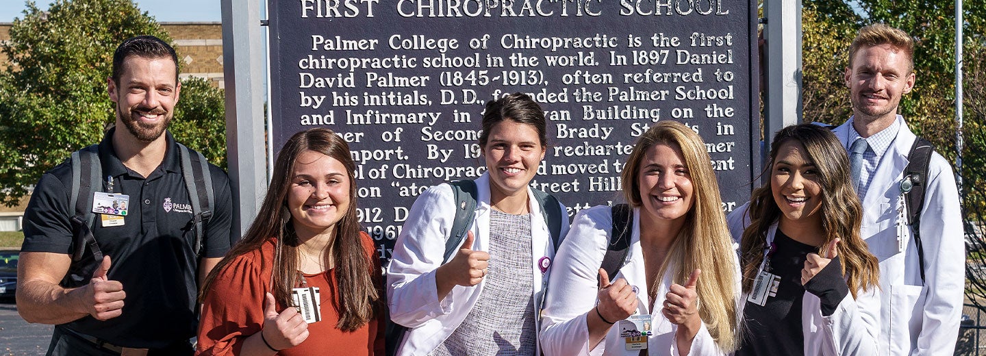 Students smiling on Palmer College campus