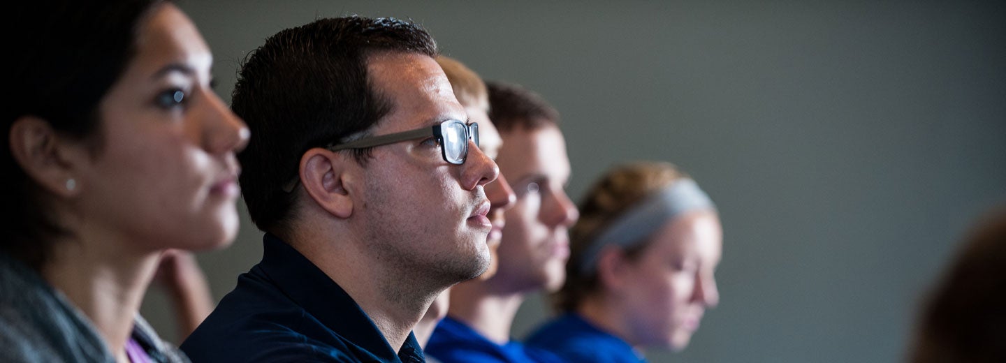 Students sitting in a lecture hall.