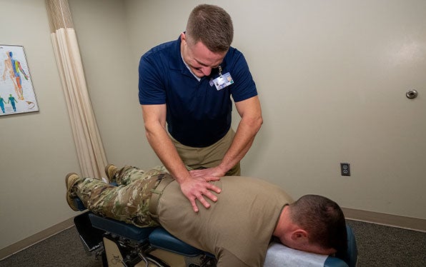 Chiropractor performing an adjustment