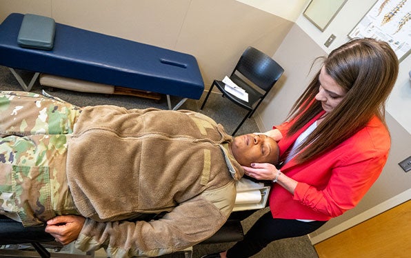 Chiropractor performing an adjustment