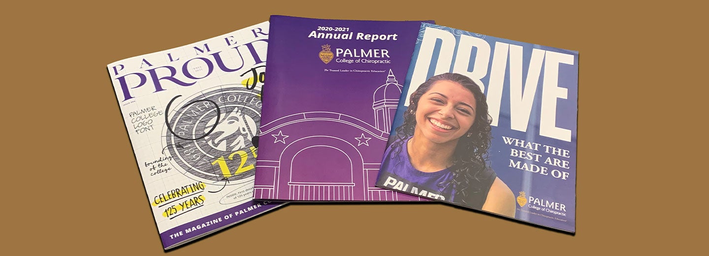 Copies of Palmer Proud laid out on a table