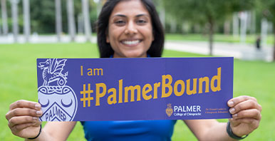 Person holding a sign that says Palmer Bound