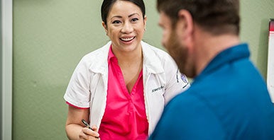 Chiropractor talking with a patient