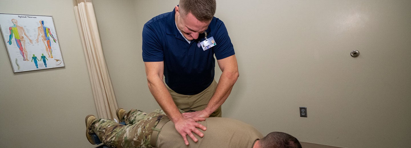 Chiropractor performing an adjustment