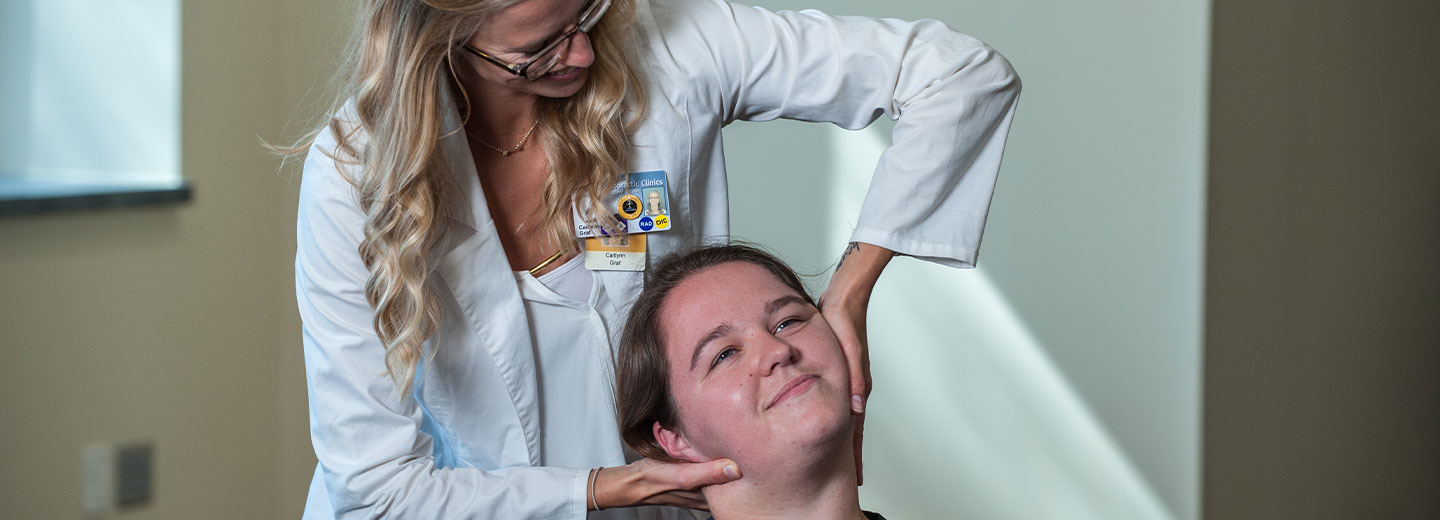 chiropractic intern performing an examination