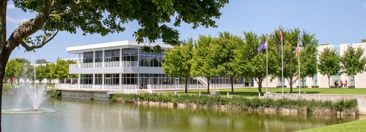 Florida campus building and pond/