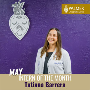 Tatiana Barrera in white clinic coat in front of purple wall