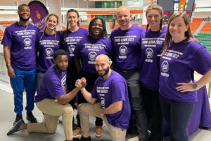 Group of students in purple shirts