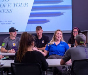 group of students listening to instructor