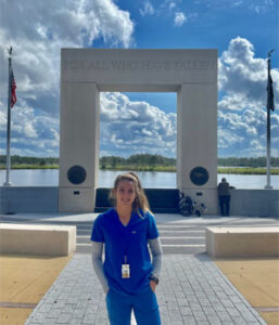 Palmer Florida student Brittany Pase in front of VA facility.