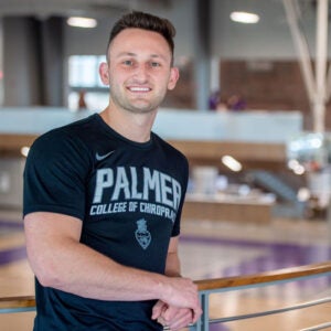 Jacob Temple in Palmer shirt with Palmer basketball court in background.