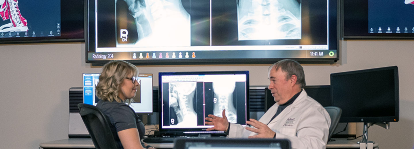 Dr. McLean and student reviewing X-rays.