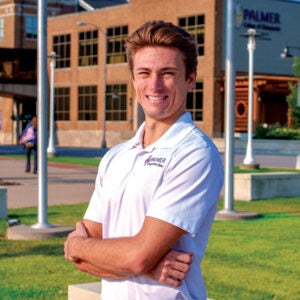 Student Jacob Kwast in front of Palmer building.