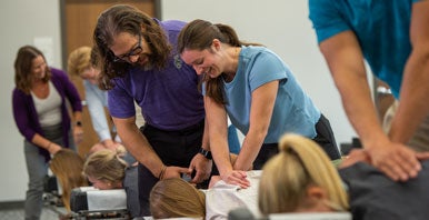 Instructor and students in learning lab.