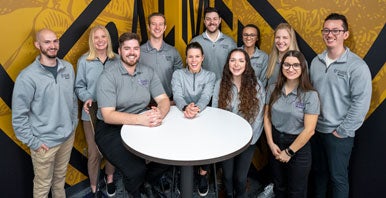 Group of Campus Mentors in gray polos.