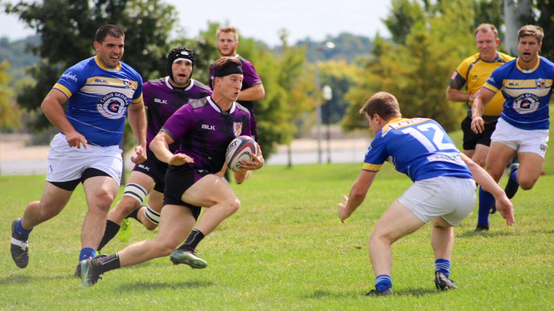 Men's rugby team playing.