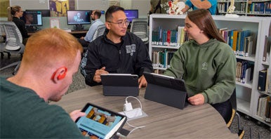 Students studying on tablets in Library.