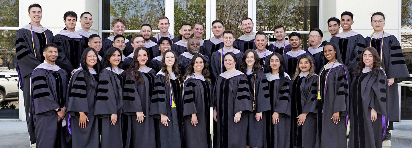 Large group photo of Palmer West Class 168 in graduation gowns.