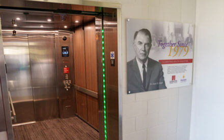 David Palmer display next to elevator at EICC.