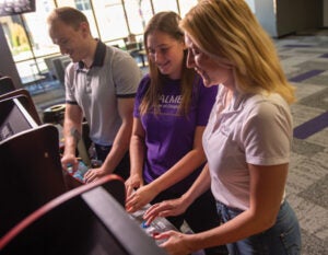 Students playing in the Student Union Arcade on Palmer's Main Campus. 