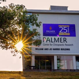 Research Building with 25 year anniversary banner.