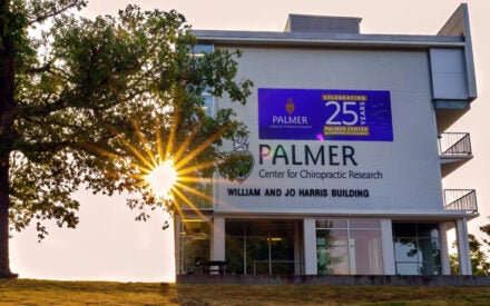 Research Building with 25 year anniversary banner.