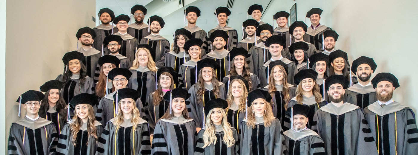 Florida class 252 in graduation cap and gowns.