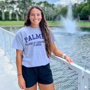 Tyra Wingle standing in front of the fountain on Palmer Florida's campus. 