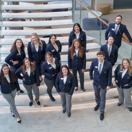 Campus Guides on monumental staircase.
