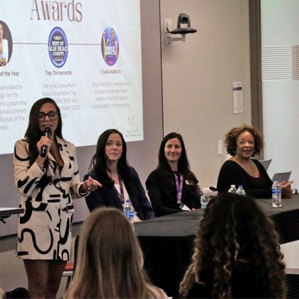Dr. Colón speaking on women's panel.