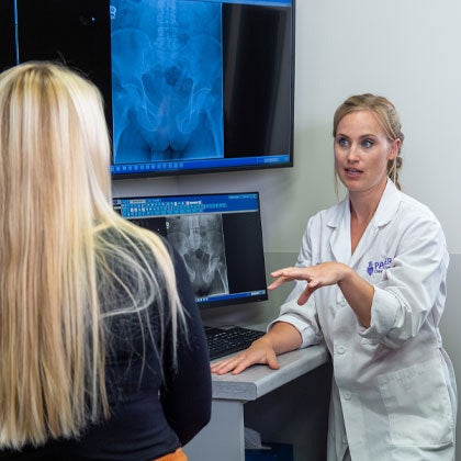 Dr. Clark reviewing X-ray with patient.