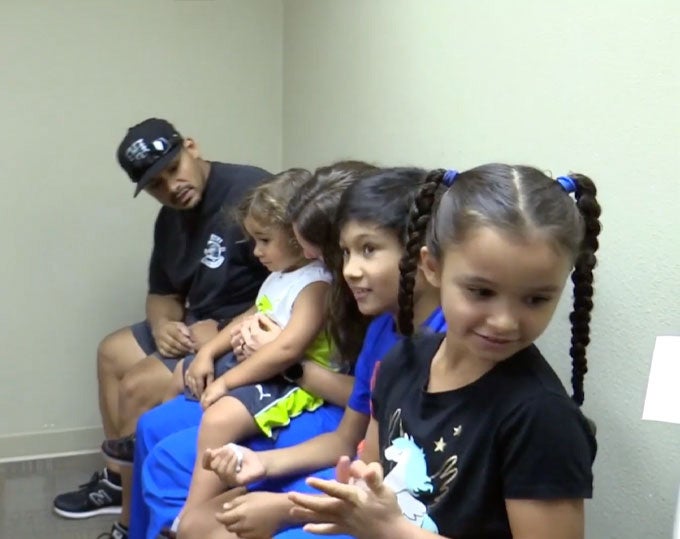 Family in clinic waiting room.