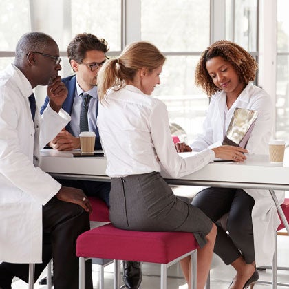 Group of clinicians collaborating on patient case.
