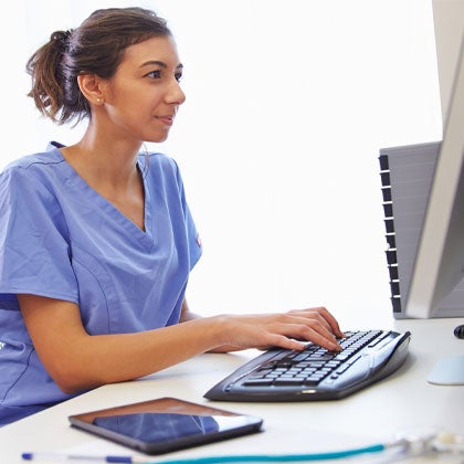 Woman working on computer.