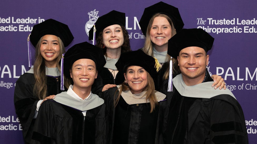 Students and faculty in cap and gowns.