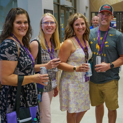Alumni group enjoying drinks at Homecoming.
